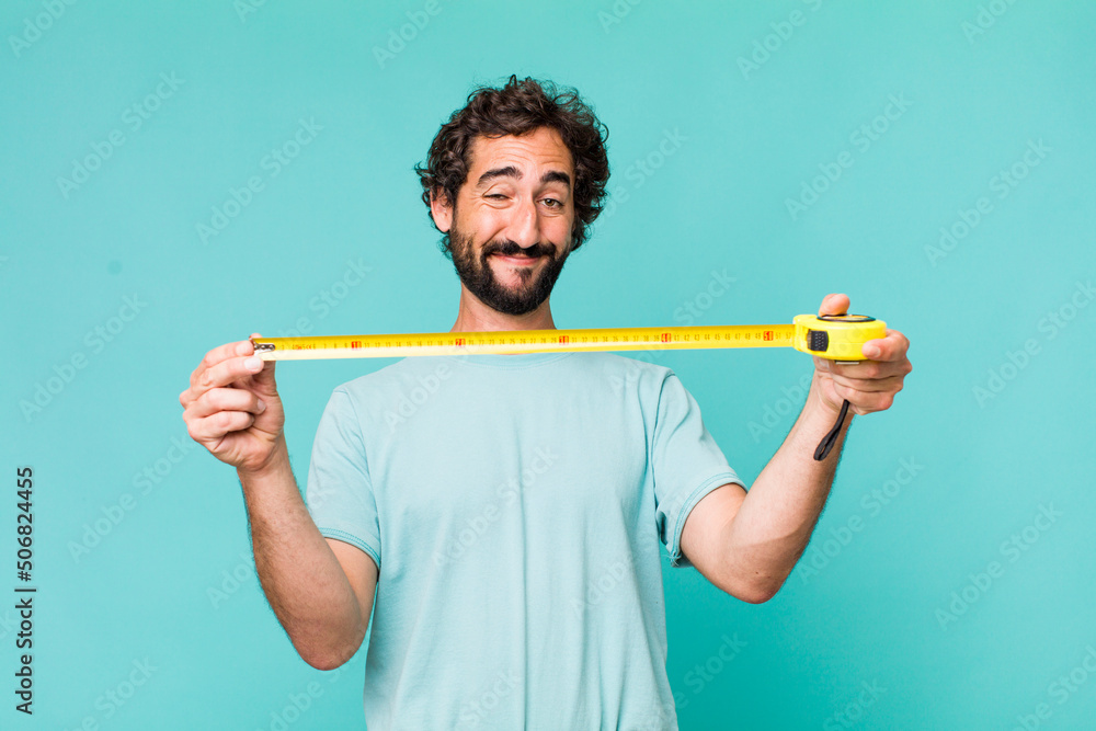 young adult hispanic crazy man with a medition meter - obrazy, fototapety, plakaty 