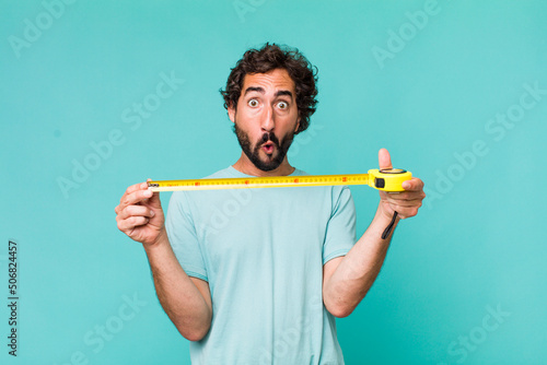 young adult hispanic crazy man with a medition meter photo