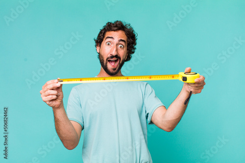 young adult hispanic crazy man with a medition meter photo