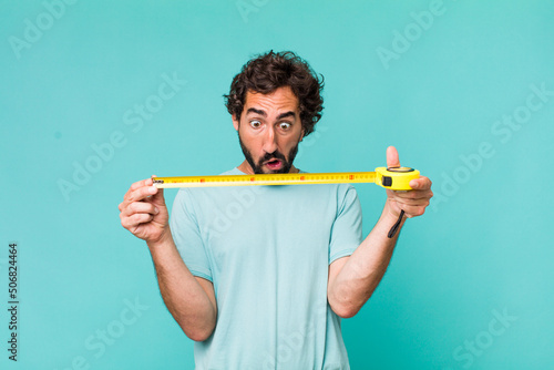 young adult hispanic crazy man with a medition meter photo