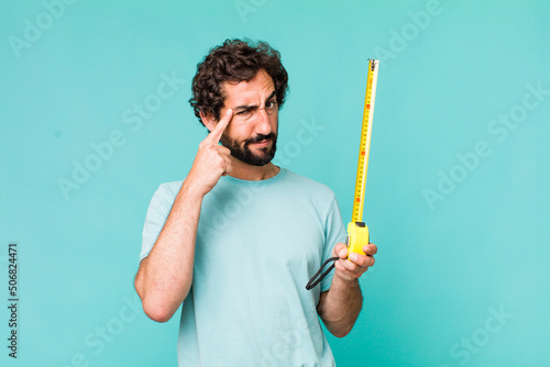 young adult hispanic crazy man with a medition meter photo