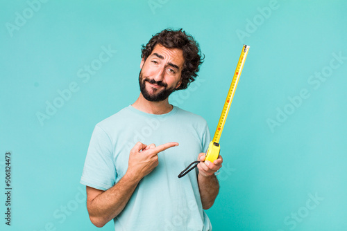 young adult hispanic crazy man with a medition meter photo