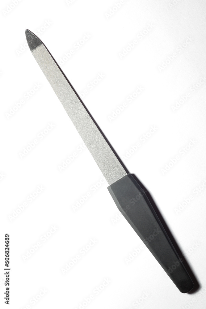 grey nail file on a light white background grey nail file on a light white background