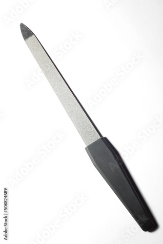 grey nail file on a light white background