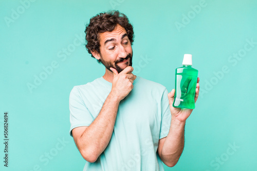Cuadro en lienzo young adult hispanic crazy man. mouthwash concept