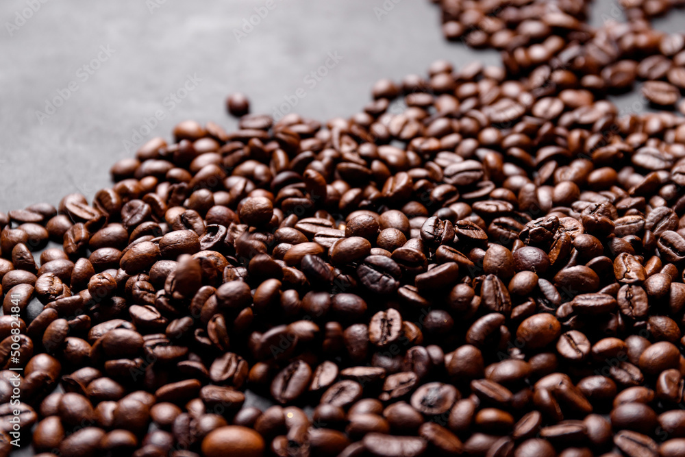 Fototapeta premium Hot fresh black coffee with milk foam for morning menu in white ceramic cup with coffee beans roasted on.