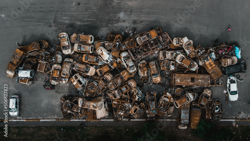 Irpin, Kyiv region, Ukraine - 19.05.2022 , a lot of burnt shelled cars in the parking lot, the consequences of the invasion of the Russian army in Ukraine. War in Ukraine. Drone photo