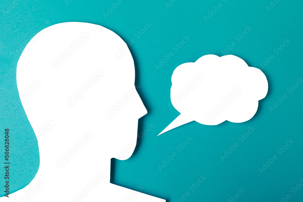 paper face and speech bubble on colorbackground copy space for text, communication, symbolic- Image paper face and speech bubble on colorbackground copy space for text, communication, symbolic- Image
