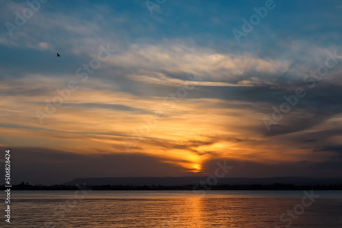 Panoramic view during sunset on the harbor of Ortigia island in the city Syracuse, Sicily, Italy, Europe, EU. Romantic water reflection in the Siracusa bay in the Mediterranean Sea. Vacation seaside © Chris