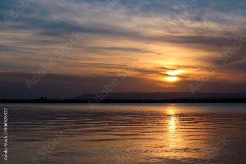 Panoramic view during sunset on the harbor of Ortigia island in the city Syracuse, Sicily, Italy, Europe, EU. Romantic water reflection in the Siracusa bay in the Mediterranean Sea. Vacation seaside © Chris