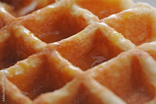 Closeup of waffle with syrup