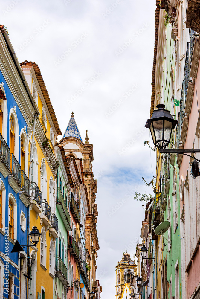 Facades of old houses and church towers in colonial style in the streets of the Pelourinho neighborhood in the city of Salvador, Bahia