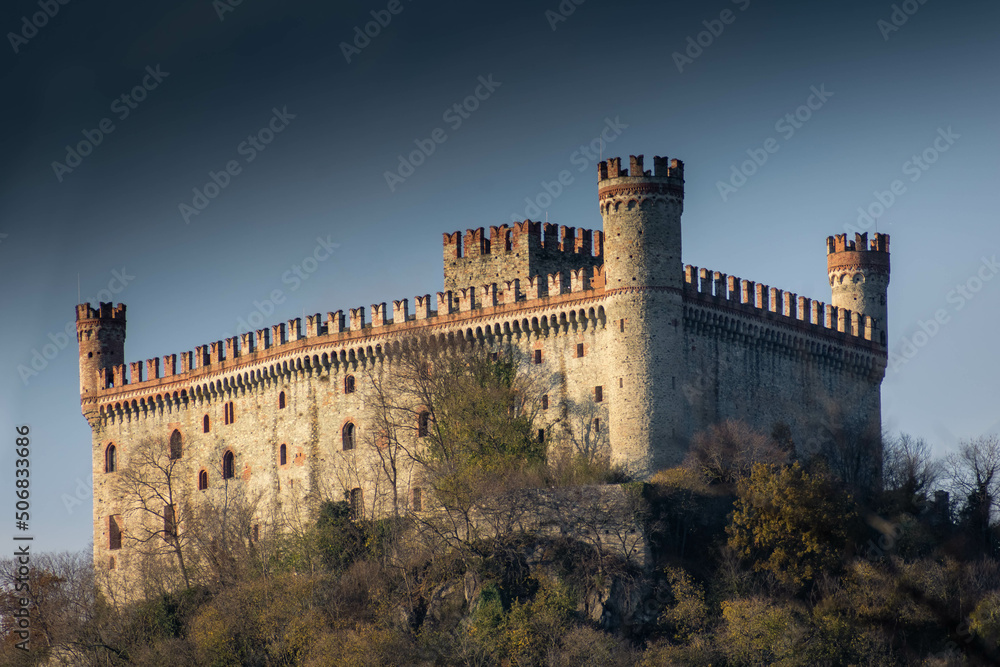Historical Castle of Montalto Dora upon a hill in autumn, Piedmont Italy