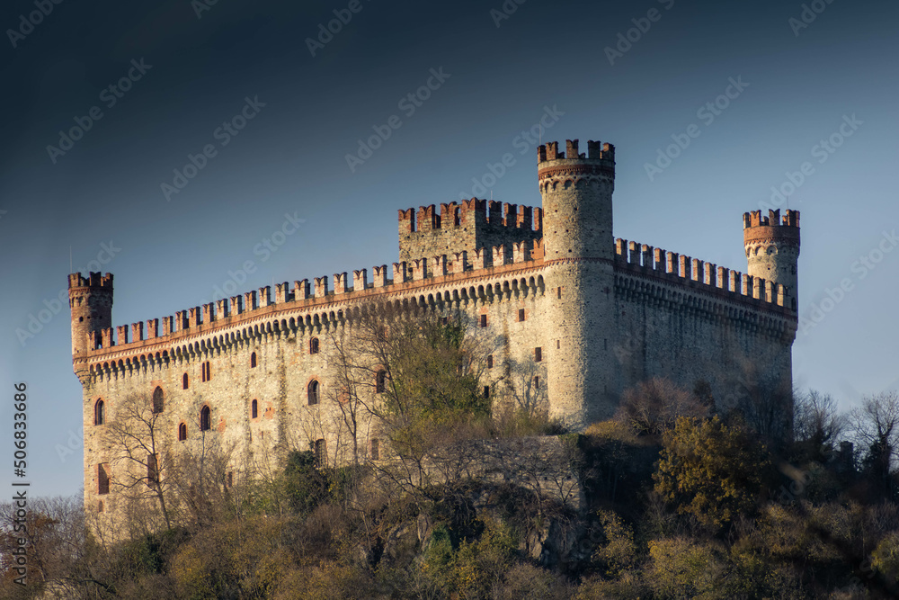 Historical Castle of Montalto Dora upon a hill in autumn, Piedmont Italy Historical Castle of Montalto Dora upon a hill in autumn, Piedmont Italy