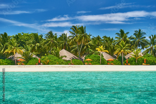 Tropical beach in Maldives. Travel and tourism to luxury resorts in the Maldives islands. Summer holiday concept