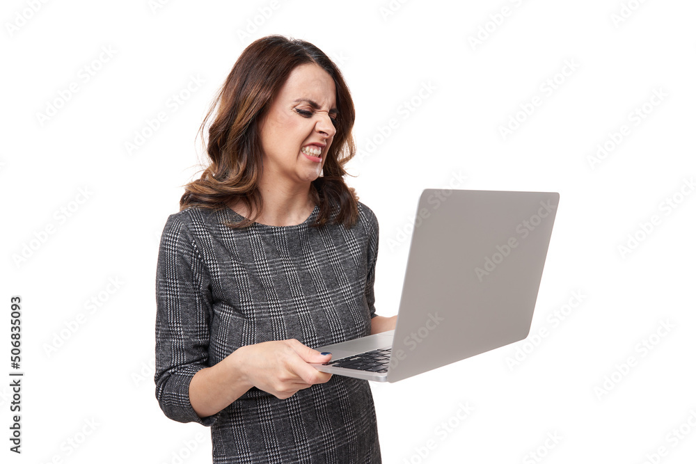 Frustrated furious businesswoman with her laptop on white background