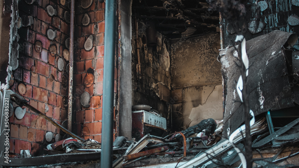 Irpin, Kyiv Oblast, Ukraine - 19.05.2022: Cities of Ukraine after the Russian occupation. burnt and destroyed civilian building in city of Irpin, northwest of Kyiv. close up