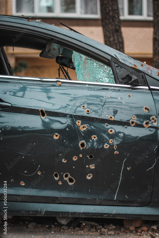 Irpin, Kyiv Oblast, Ukraine - 19.05.2022: Cities of Ukraine after the Russian occupation. destroyed civilian car in city of Irpin, northwest of Kyiv