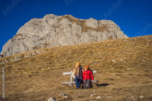 Montenegro. Mom and son tourists in the background of Durmitor National Park. Saddle Pass. Alpine meadows. Mountain landscape. Travel around Montenegro concept