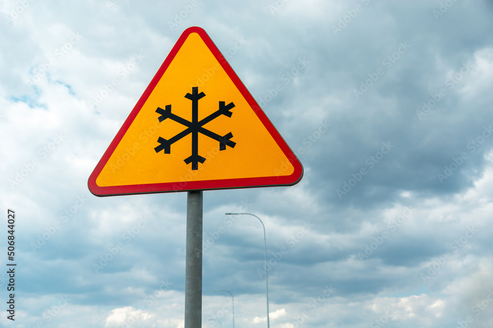 Road sign warning of road frosting, snowflake Road sign warning of road frosting, snowflake