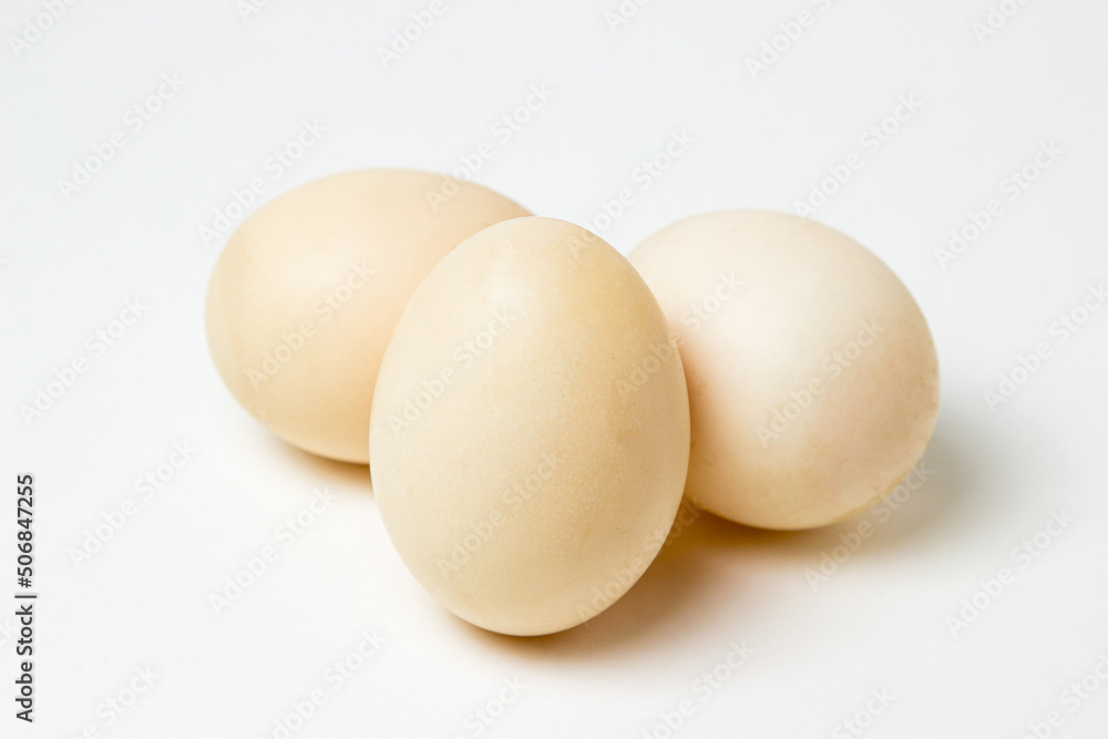 White duck eggs on a white background. Useful and delicious food. White duck eggs on a white background. Useful and delicious food.