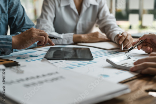 Business concept. Business people discussing the charts and graphs showing the results of their successful teamwork