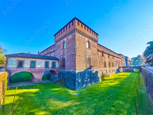 The medieval walls and Torre Falconiera tewer of Sforza's Castle in Milan, Italy photo