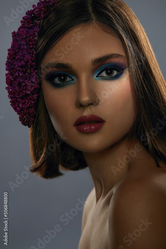Portrait of a beautiful young girl with exquisite fantasy make-up