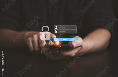 Man using smartphone to input username and password for technology security system and prevent hacker concept.