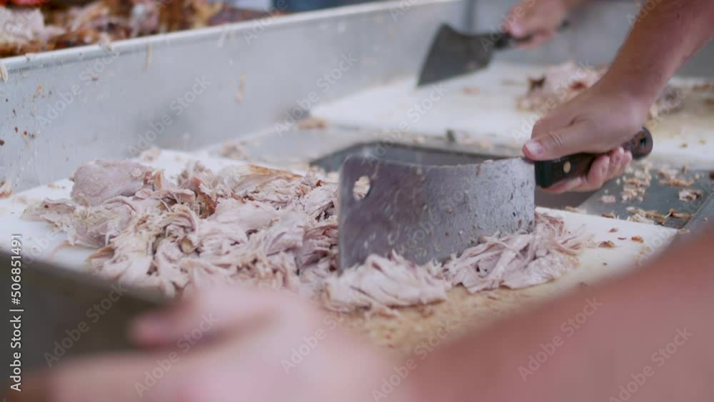 Tight shot of chopping pulled pork BBQ Tight shot of chopping pulled pork BBQ