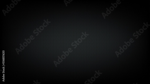 Textured background from metal mesh in form of honeycomb on dark background lit in center. Layer to overlay on photos and videos.