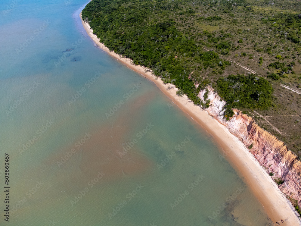 Amazing paradisiacal and deserted beach with clear blue waters and visible corals at low tide - Cumuruxatiba, Bahia, Brazil - aerial drone view Amazing paradisiacal and deserted beach with clear blue waters and visible corals at low tide - Cumuruxatiba, Bahia, Brazil - aerial drone view