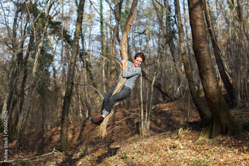 Mid Adult Woman Enjoying and having fun in Forest  Wilderness