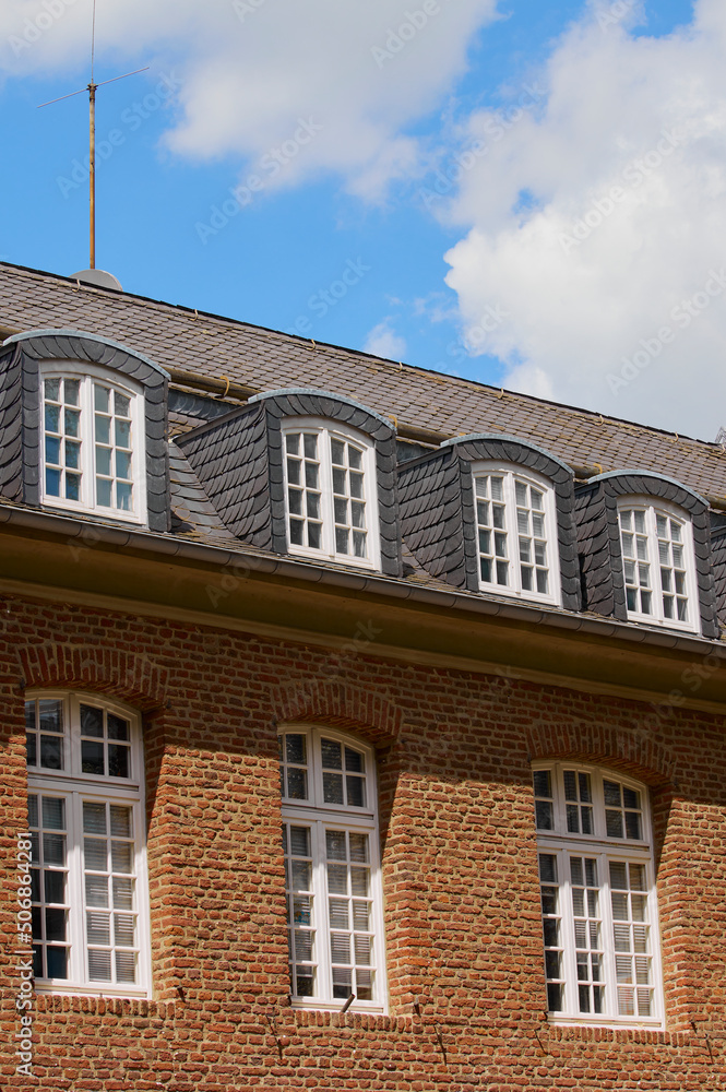 a front view of windows on a roof of a house in Heinsberg,Germany a front view of windows on a roof of a house in Heinsberg,Germany