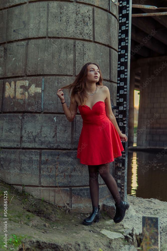A woman is posing in front of a camera in an autumn park. autumn photo shoot. Autumn in the park. A woman is posing in front of a camera in an autumn park. autumn photo shoot. Autumn in the park.