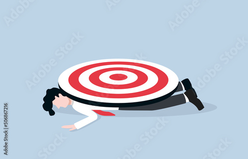 Failed business goal, missed target, working error, wrong marketing strategy concept. Unconscious businessman lying face down on floor while big archery target placing on his body.