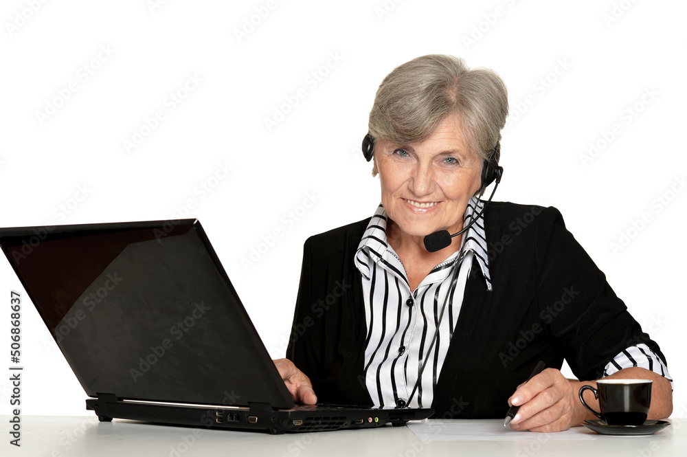 elderly woman working with laptop on white background elderly woman working with laptop on white background