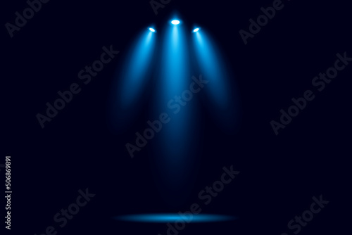 Blue spotlights on black background.