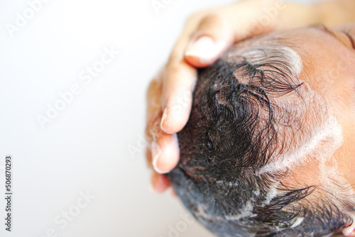 Asian newborn baby or little baby (about 2-5 months) is washing hair by mother with love, care, encourage empathy, lovely, cute.