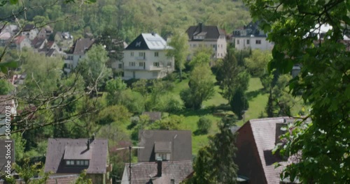 Wallpaper Mural Wide panorama of hillside homes on the famous Balvarian hillsides in downtown Stuttgart from behind large trees at noon, Germany, Europe, panning view angles Torontodigital.ca