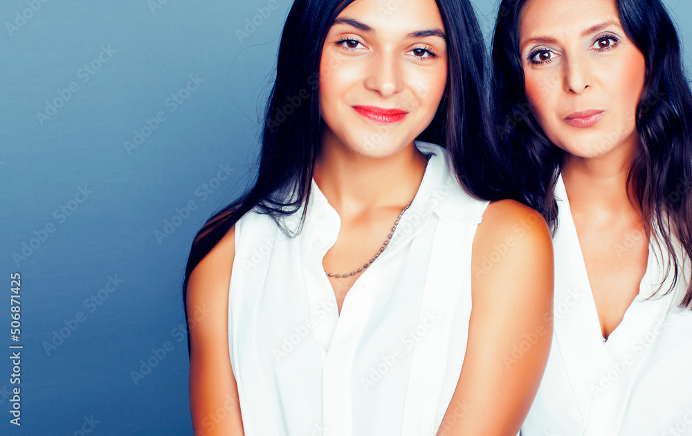 cute pretty teen daughter with mature mother hugging, fashion style brunette, lifestyle people concept cute pretty teen daughter with mature mother hugging, fashion style brunette, lifestyle people concept