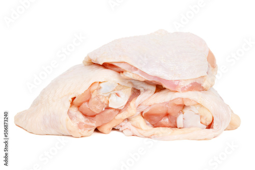 Raw chicken thigh isolated on white background.