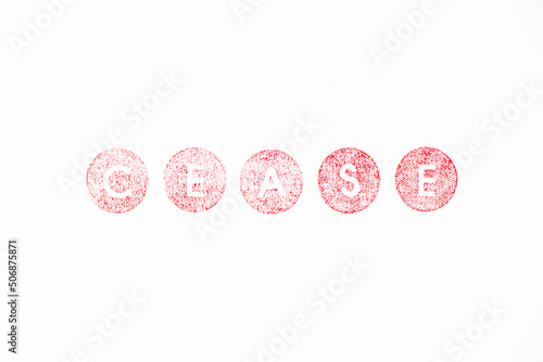 Red color rubber stamp in word cease on white paper background
