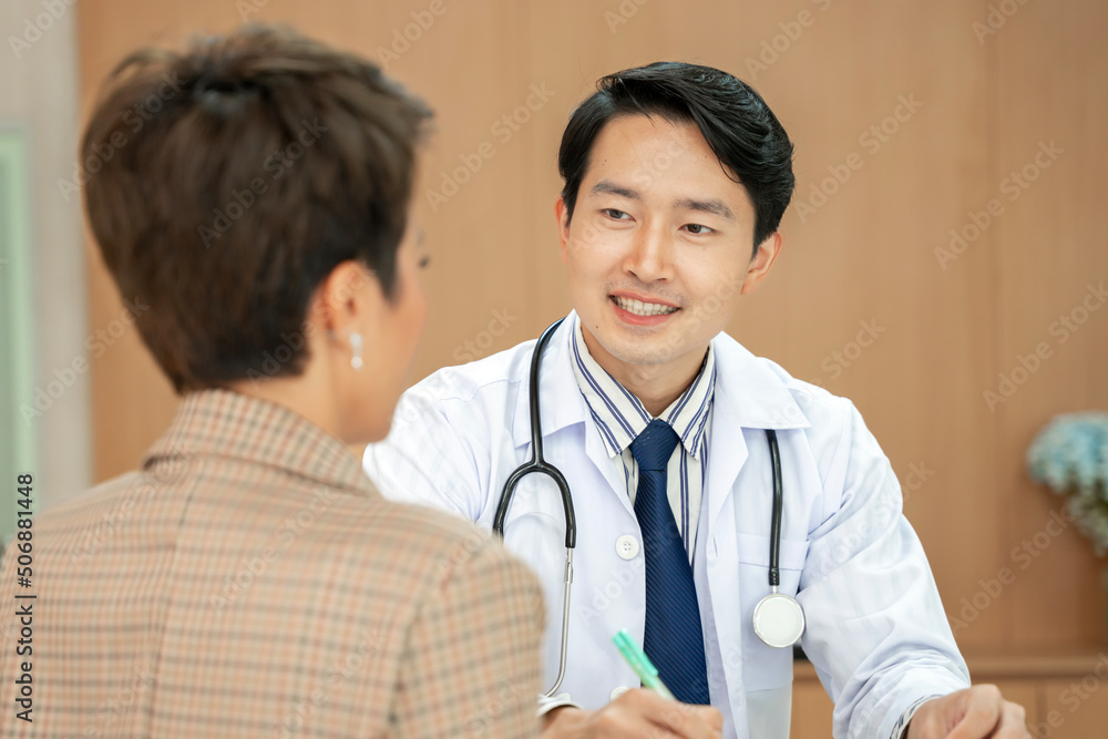 doctor talking to patient To maintain health with a smile, the concept is health care. Elderly patients, adolescent doctors doctor talking to patient To maintain health with a smile, the concept is health care. Elderly patients, adolescent doctors