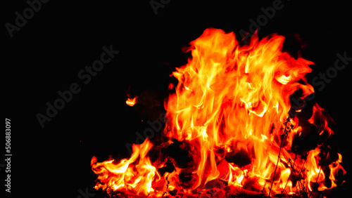 Red red flames of a fireplace with dark background, sao john´s campo´s commemorative date in Brazil