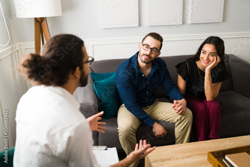 Attractive couple saving their marriage with therapy photo