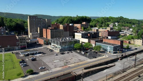 aerial fast push over railroad tracks and into the bluefield west virginia skyline photo