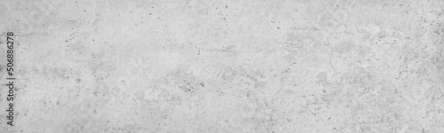 White vintage texture. Rough concrete wall surface with old plaster. Light gray grunge background with space for design. Web banner. Wide. Panoramic.