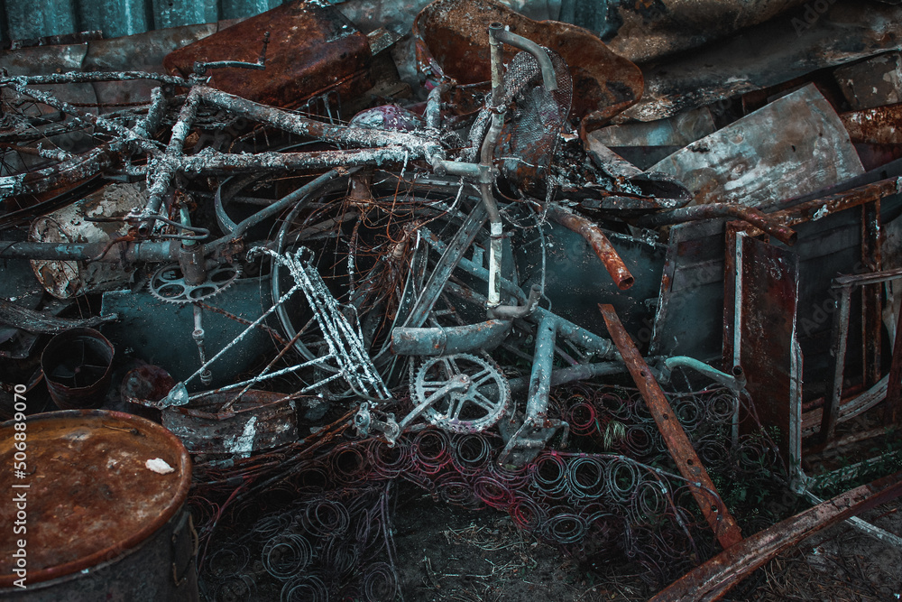 Irpin, Kyiv Oblast, Ukraine - 23.05.2022: Cities of Ukraine after the Russian occupation. destroyed and burnt civilian bike in city of Irpin, northwest of Kyiv. Close up