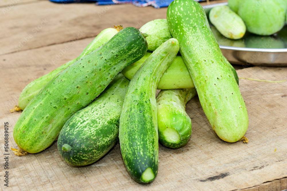 cucumbers on a wooden table cucumbers on a wooden table